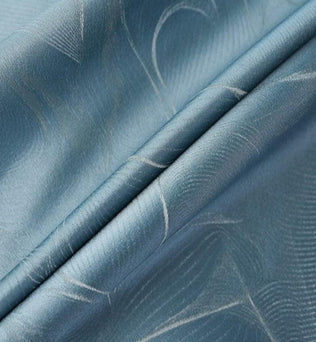 Tissu bleu élégant avec motifs subtils pour décoration intérieure ou confection de vêtements. Idéal pour apporter une touche de sophistication et de modernité à vos projets textiles. Parfait pour la création de rideaux, de nappes ou de vêtements élégants.