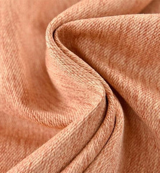 Tissu texturé rose pâle, idéal pour des créations élégantes et modernes. Drapé fluide avec un motif subtil, parfait pour la confection de vêtements raffinés ou pour l'ameublement intérieur. Couleur chaleureuse ajoutant une touche de douceur à tout projet.