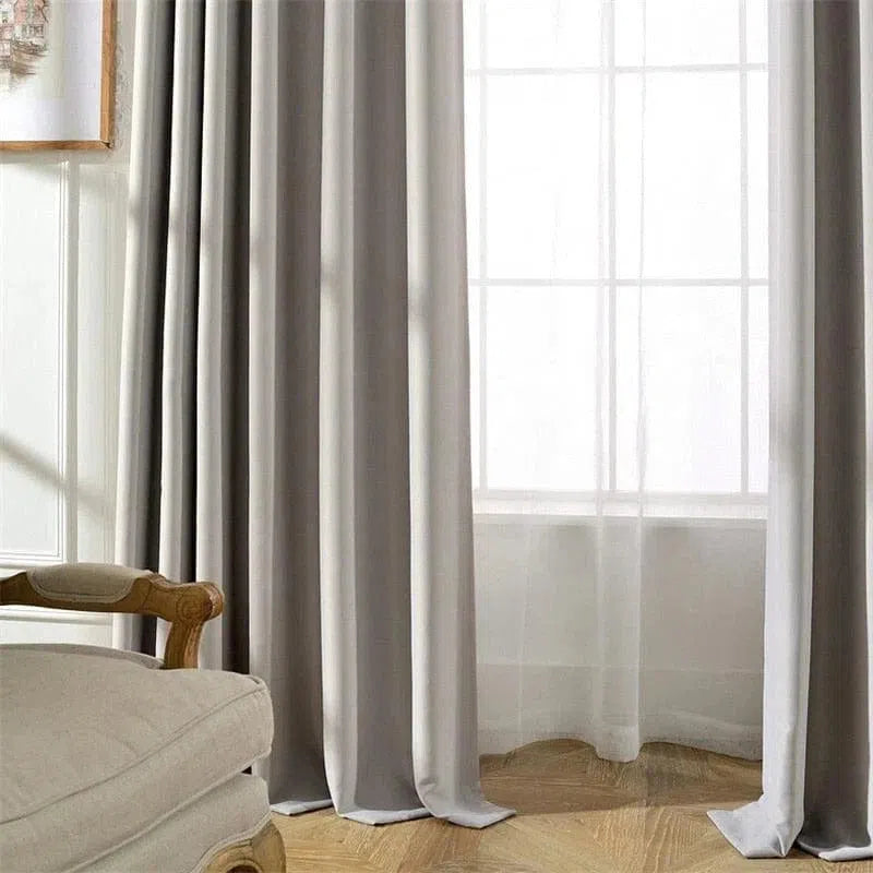 Rideaux élégants gris pour salon, apportant une ambiance moderne et raffinée. Accessoire décoratif idéal pour tamiser la lumière tout en ajoutant une touche de sophistication à votre intérieur. Parfait pour un style contemporain et chaleureux.