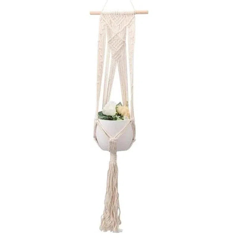 Suspension murale pour plantes, idéale pour ajouter une touche bohème à votre décoration intérieure. Porte-plante élégant permettant de mettre en valeur vos fleurs préférées. Accessoire parfait pour sublimer votre espace de vie.
