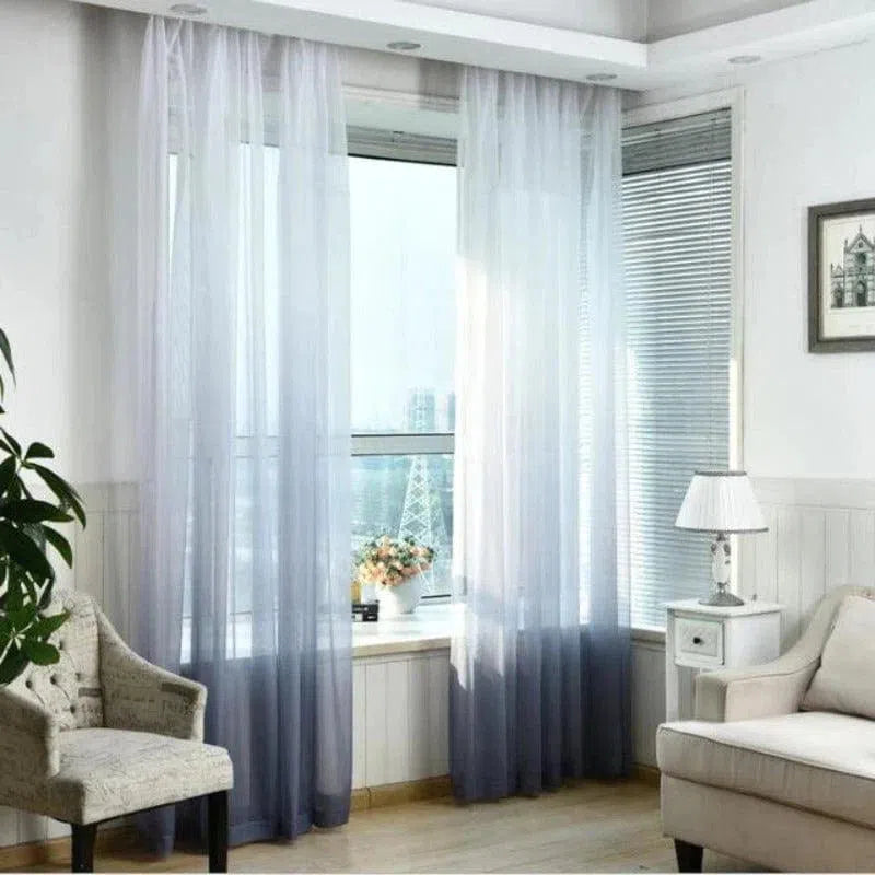 Rideaux élégants pour la décoration d'intérieur, ajoutant une touche de finesse à tout salon moderne. Ces rideaux translucides créent une ambiance lumineuse et chaleureuse tout en préservant l'intimité. Parfaits pour sublimer les grandes fenêtres, ils s'intègrent harmonieusement dans un décor contemporain. Accessoire de choix pour améliorer le style et l'élégance de votre espace de vie.